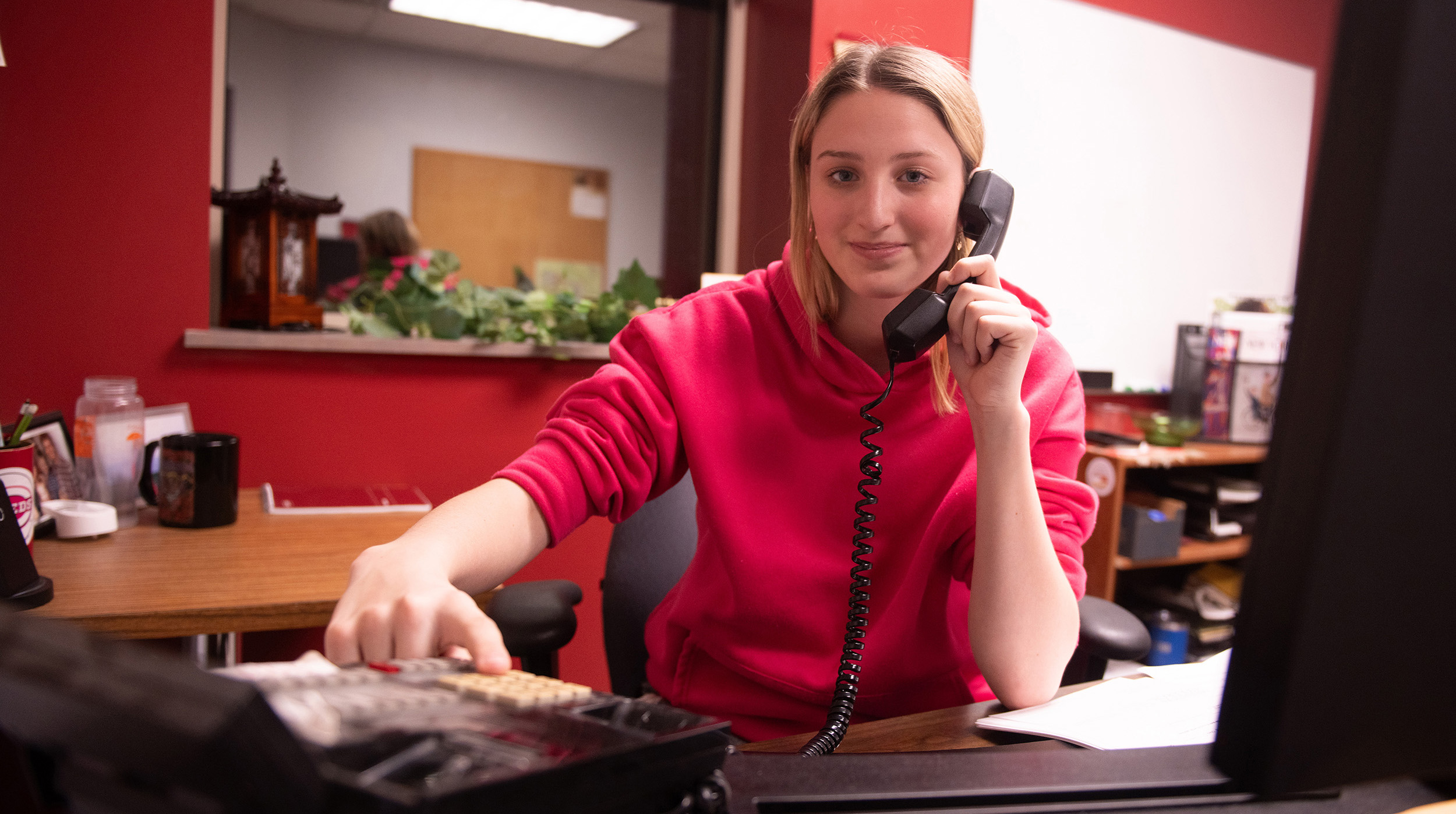 smiling student, talking on a phone