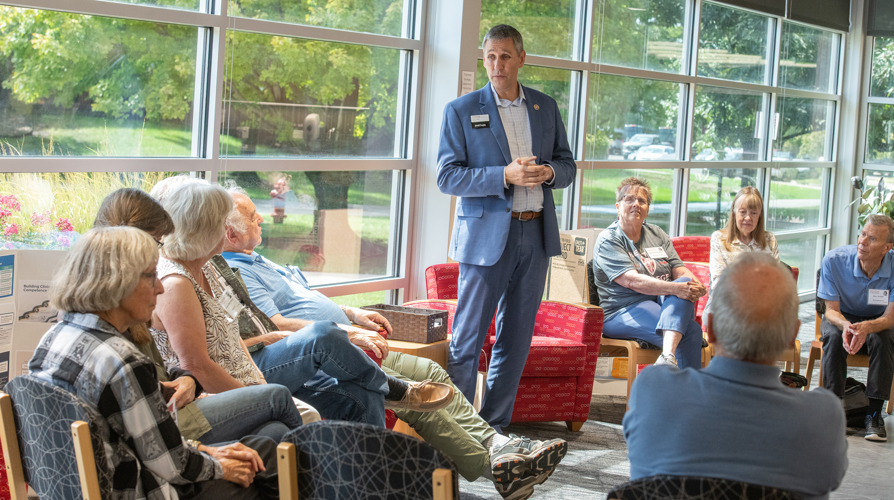 Homecoming 2026 photo - President Landes visits with the class of 1976 at their class reunion