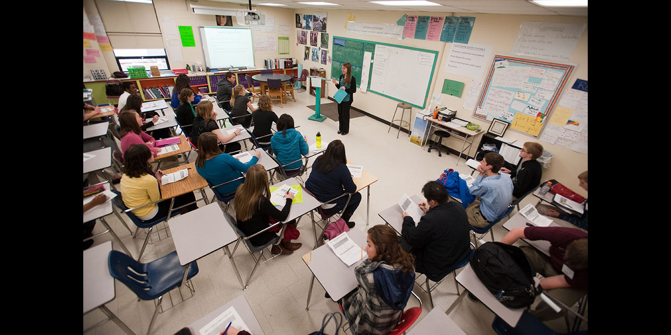 photo - Hesston College students in the spring 2012 Introduction to Education class receive an introduction to Tulsa (Okla.) Central Junior High and High School from English teacher Sadie Stockdale.