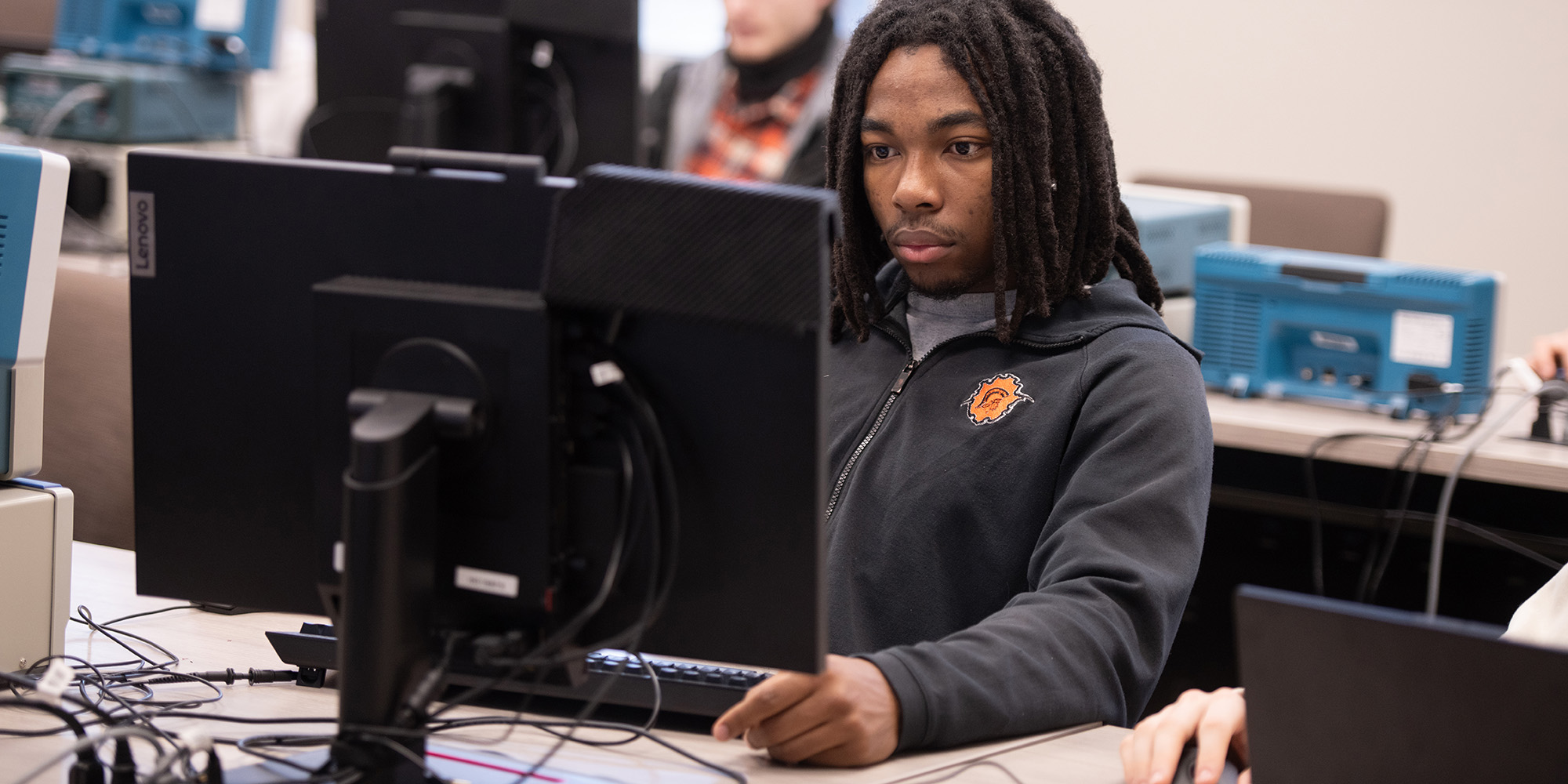 photo - student working at a computer