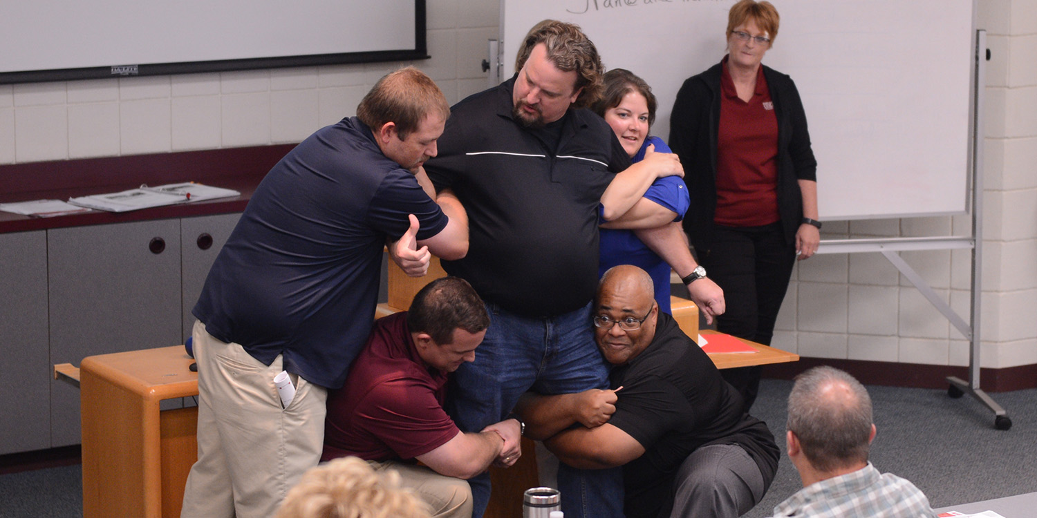 photo - A group of higher education representatives present on their take away points from Harvey County ALICE training on July 26.