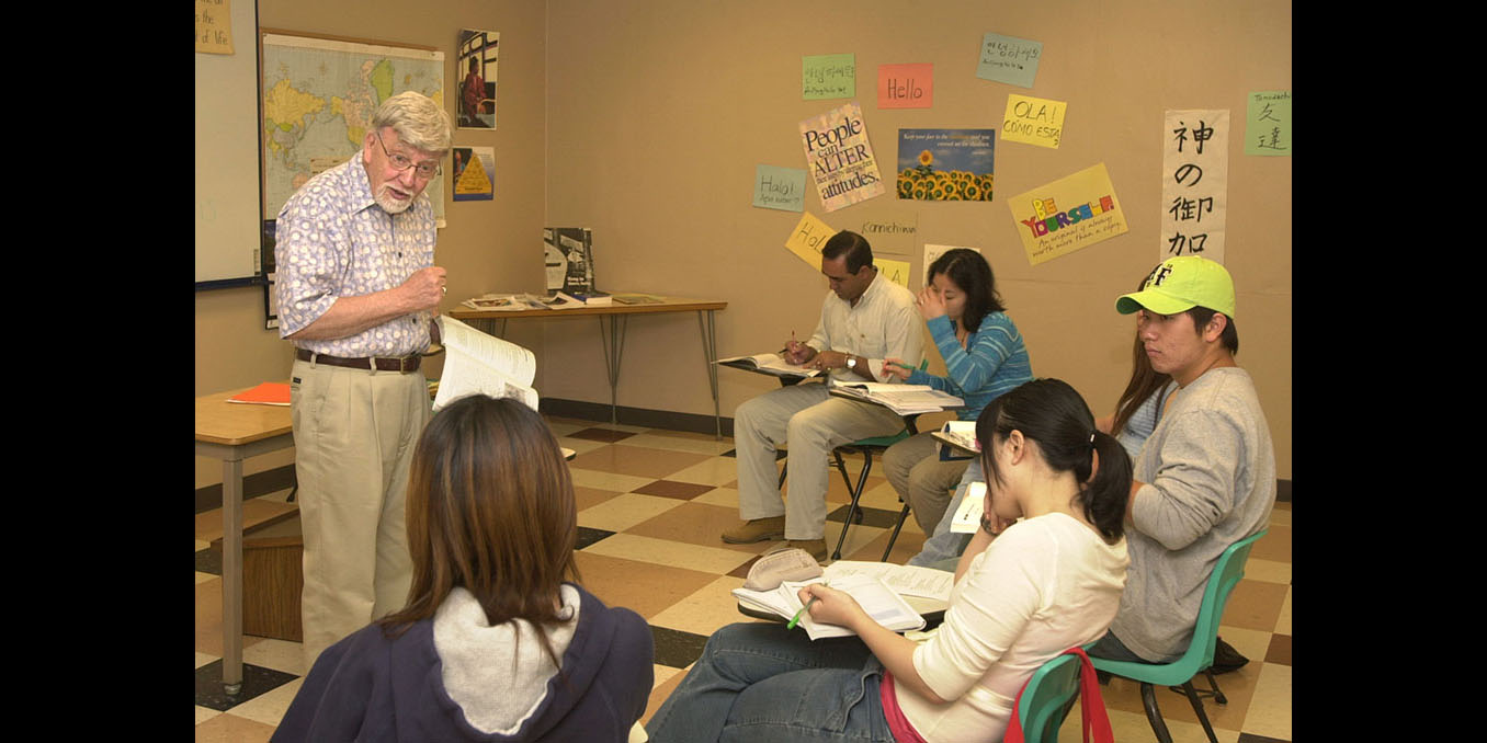photo - Hesston College professor Al Yoder explains a point during an ESL (English as a Second Language) course during the spring semester. Yoder is retiring from the college at the end of the present school year in early May.