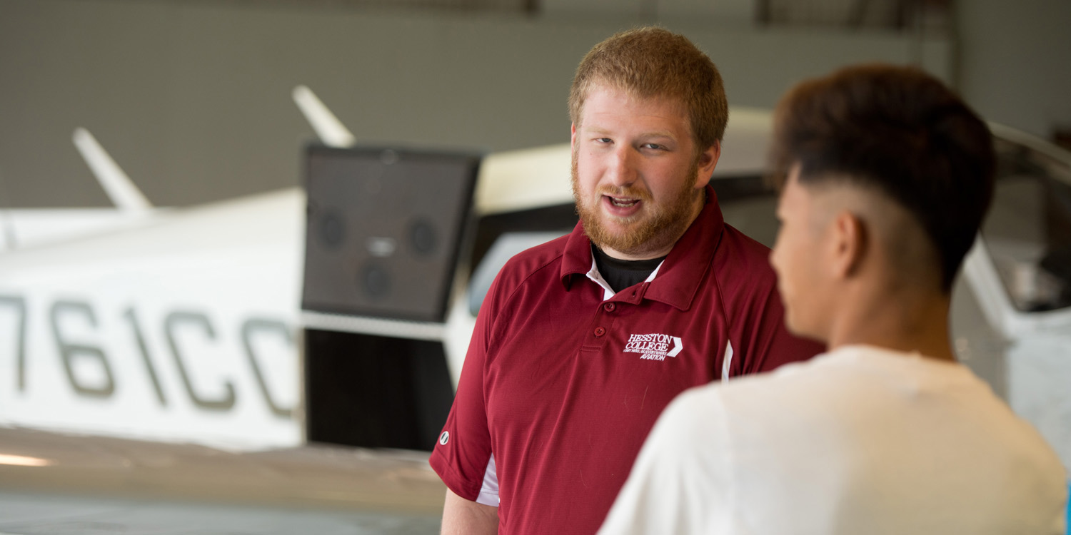 Aviation students visit at the Hesston College hangar