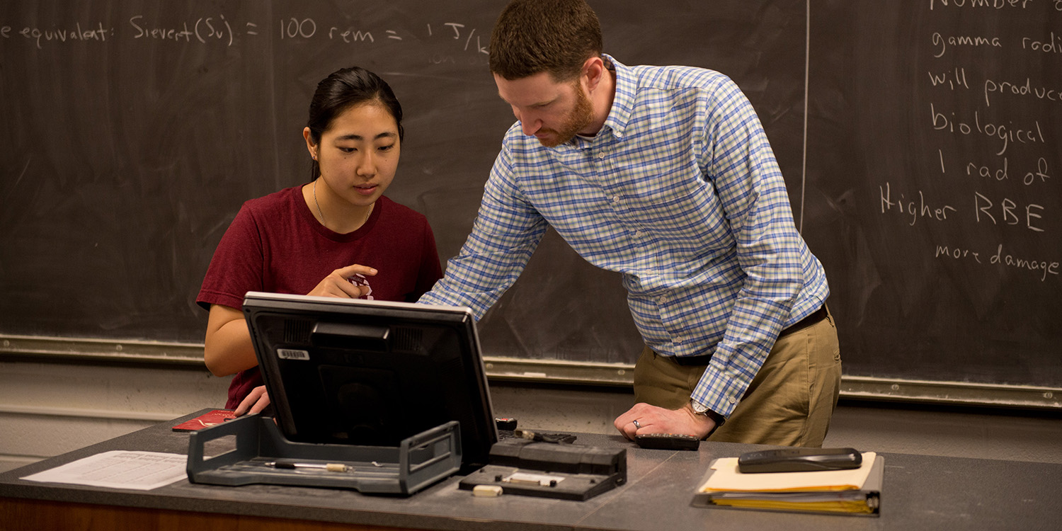Aya Iseki and Professor Joel Krehbiel work on a phyics problem