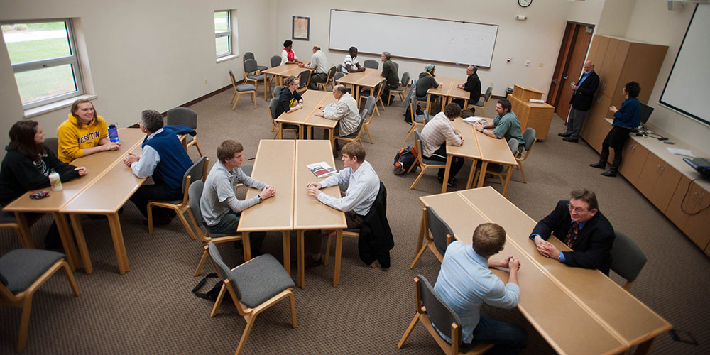 photo - Hesston College students share their experiences with Hesston College Bible classes with Bible teachers from nine Mennonite high schools April 12.