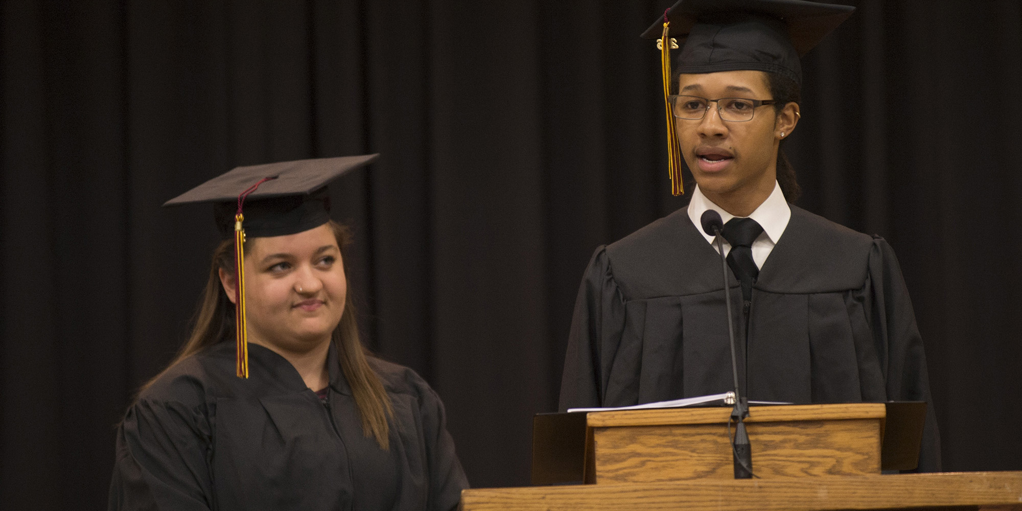 photo - Student speakers Isaiah Crosby ’16 (Ponca City, Okla.) and Emily Kauffman ’16 (Pettisville, Ohio) at Hesston College commencement 2016