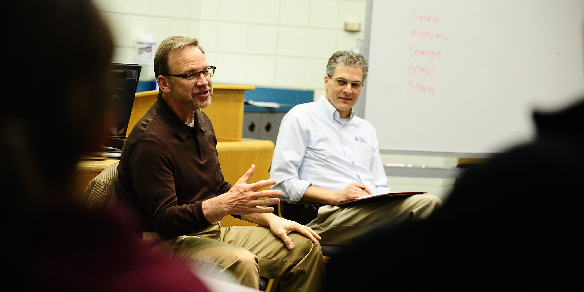 photo - David Myers (left) and Kevin King talk with the Hesston College Disaster Management Leadership class about traits of an effective leader.