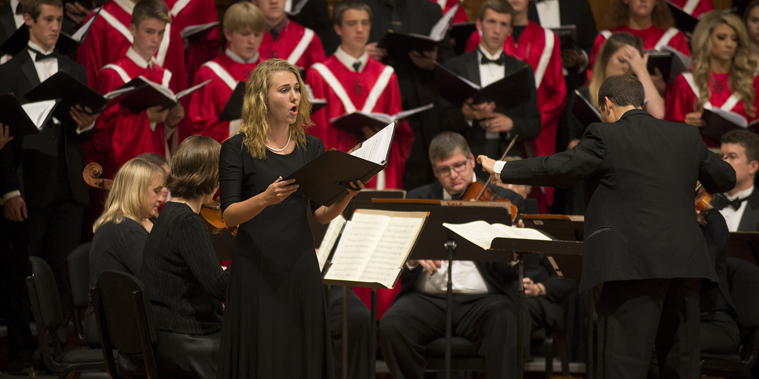 photo - Adele Hofer (sophomore, Greenwood Village, Colo.), performs a soprano solo from Mozart’s “Regina Coeli, KV 108,” along with the Hesston High Singers, the Hesston College Bel Canto Singers and the Gala Concert Orchestra Saturday evening.