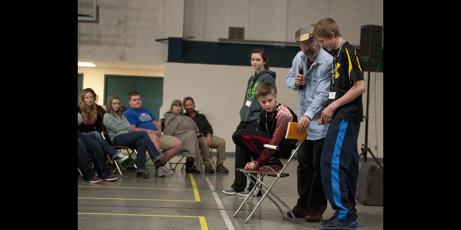 photo - Hesston College history instructor John Sharp illustrates a story of early Anabaptist martyrs with help from middle school participants during the Know Jesus event Jan. 31 to Feb. 1.