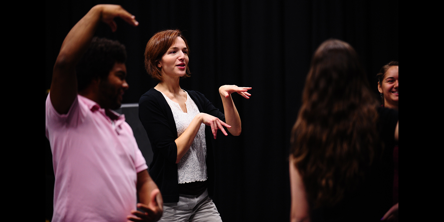 photo - Hesston College theatre director Laura Kraybill leads an acting class through a warmup exercise.