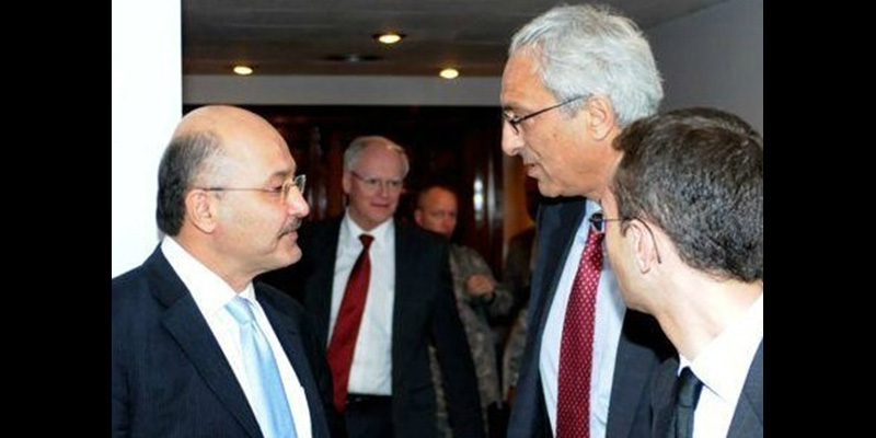 photo - Sadi Othman, second from right, speaks with Barham Salih, an Iraqi Kurdish leader.