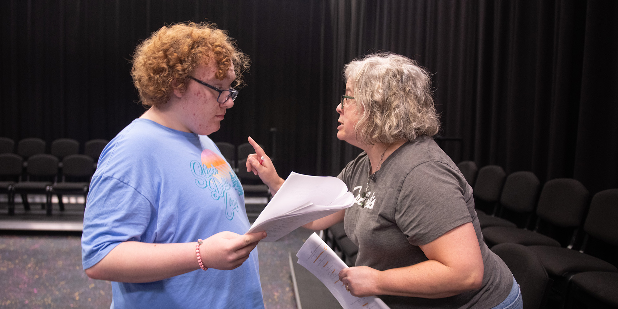 photo - Brody Hutto, Hesston College student, and Kelly Smith, community member, rehearse a scene from “6 Down” by Mitch Stutzman, one of 10 original plays featured in Hesston College’s 