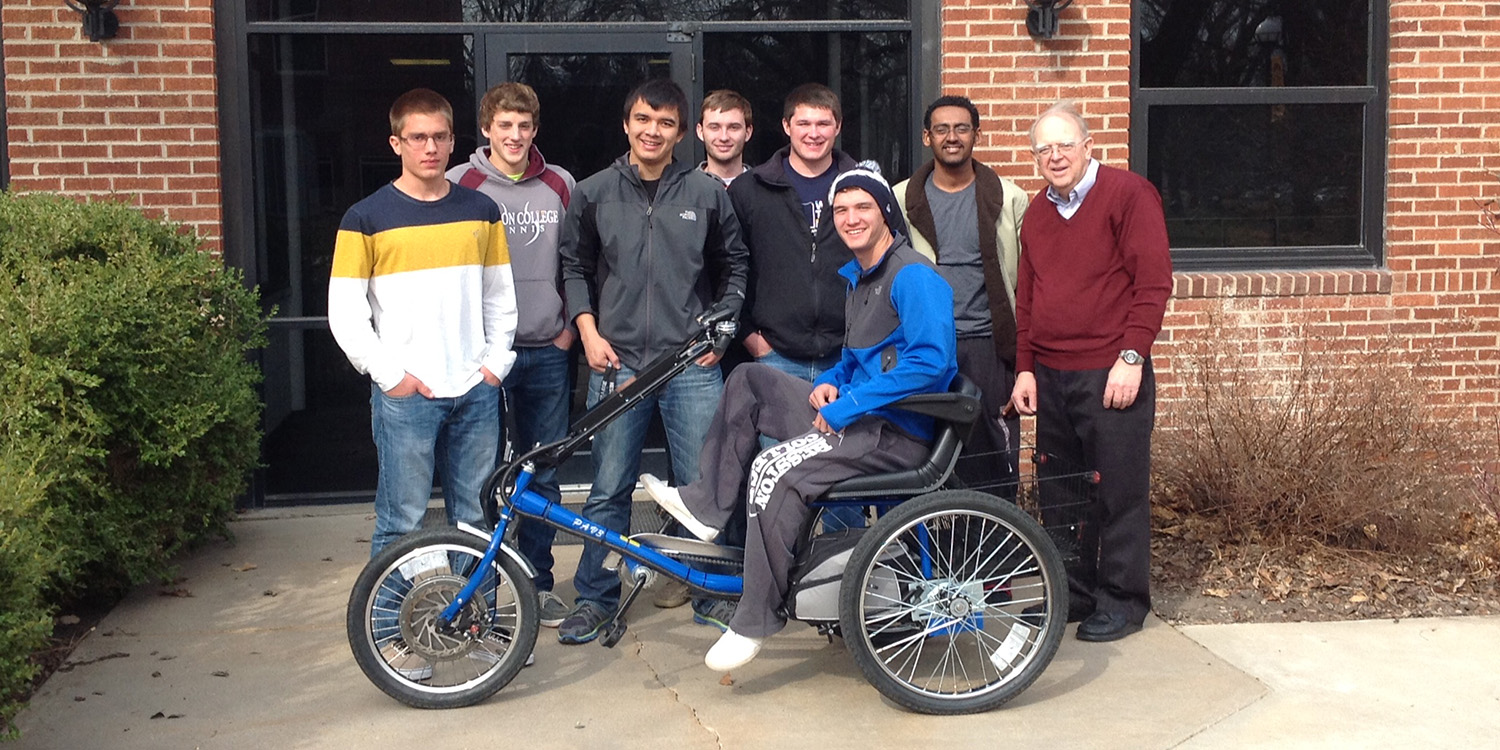 photo - Hesston College Physics II students display the solar powered personal activities vehicle they built as a class project during the spring 2014 semester.