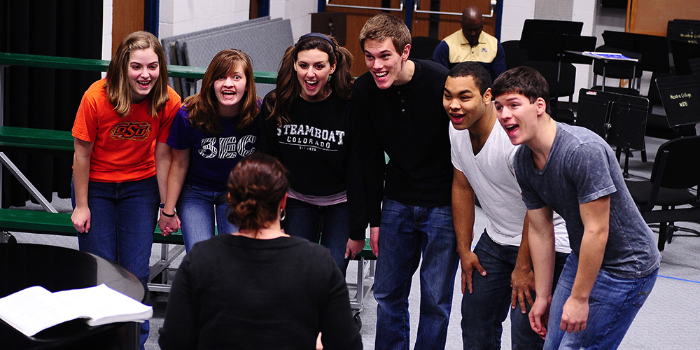 photo - Cast members rehearse for the Hesston College production of The 25th Annual Putnam County Spelling Bee