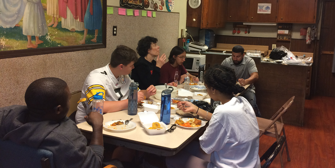 photo - Students in Hesston College's Philadelphia Urban Life and Culture class eat together.