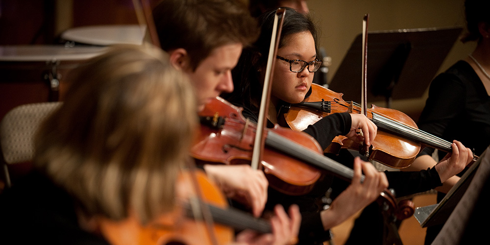 photo - Freshman Quinn Kathrineberg performs as part of Hesston College’s string ensemble.