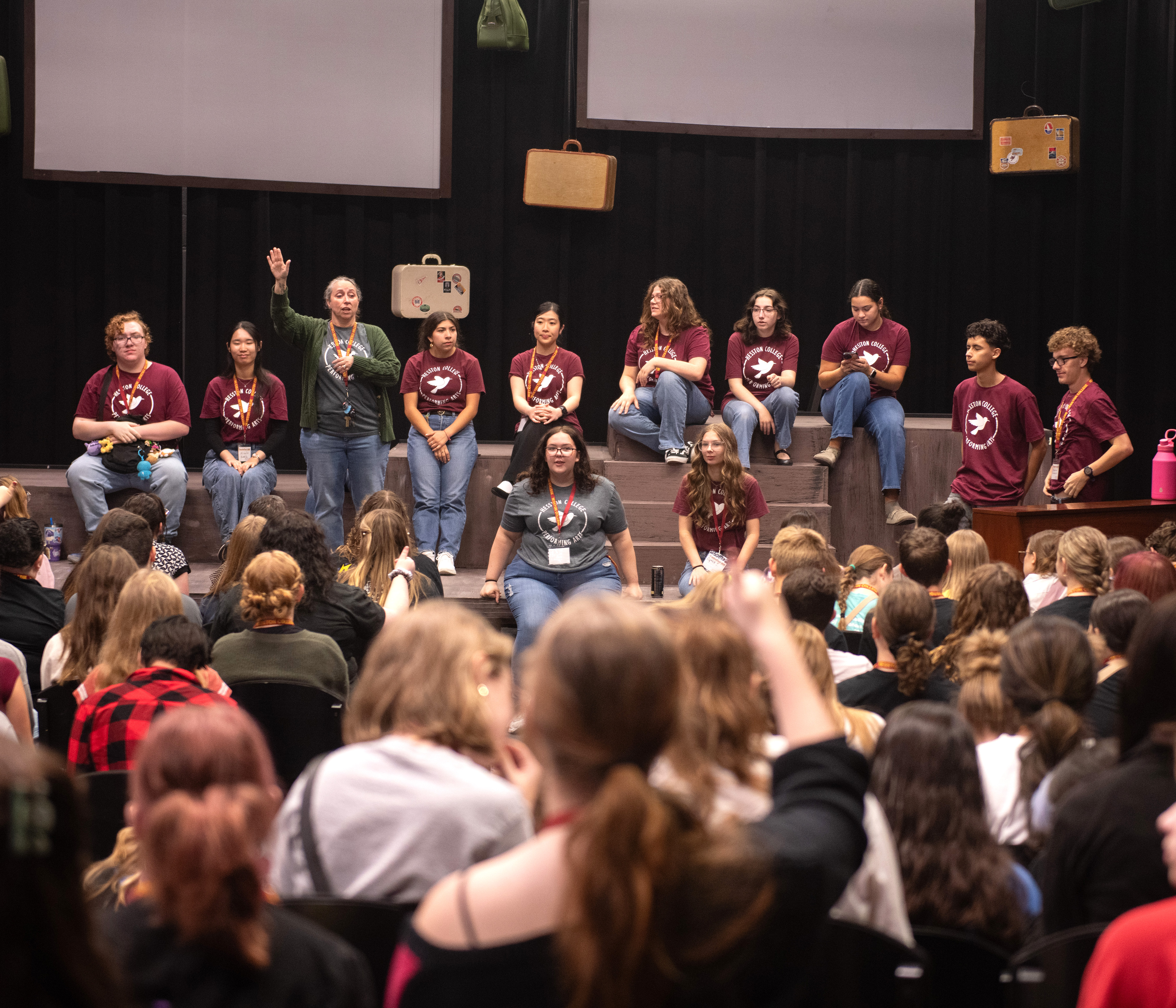 Theatre students in front of an audience of high school students at TheatreFest
