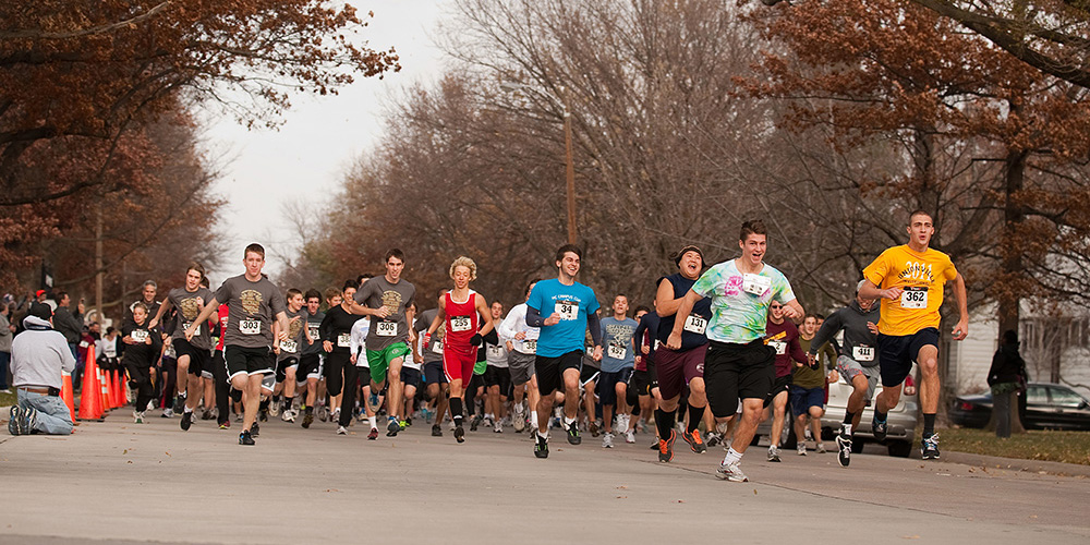photo - Participants in the 2011 Howard Hustle Two-Mile Run/Walk start the race during the Thanksgiving Weekend tradition at Hesston College.