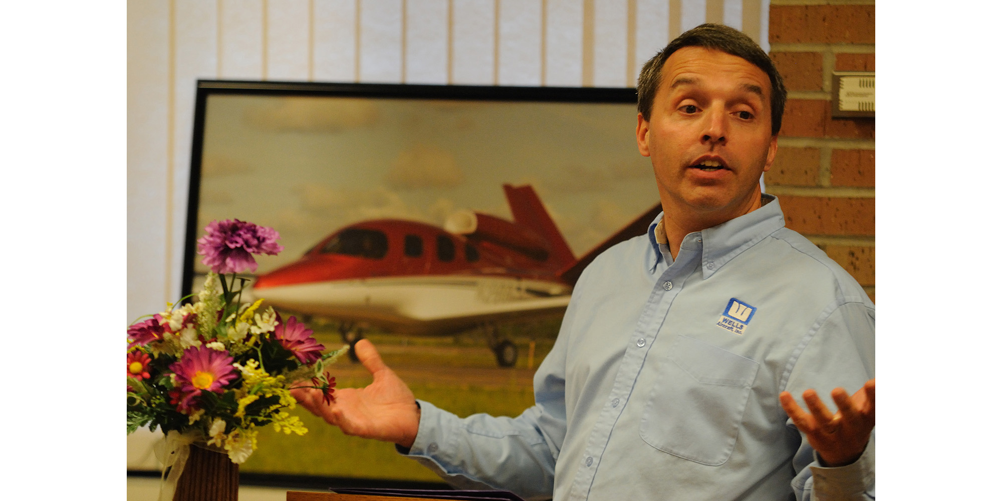 photo - Mark Miller shares about serving others in his work as a flight instructor at Wells Aircraft in Hutchinson with Hesston College students, alumni, prospective students and faculty and staff during the college’s annual Aviation as Mission event.