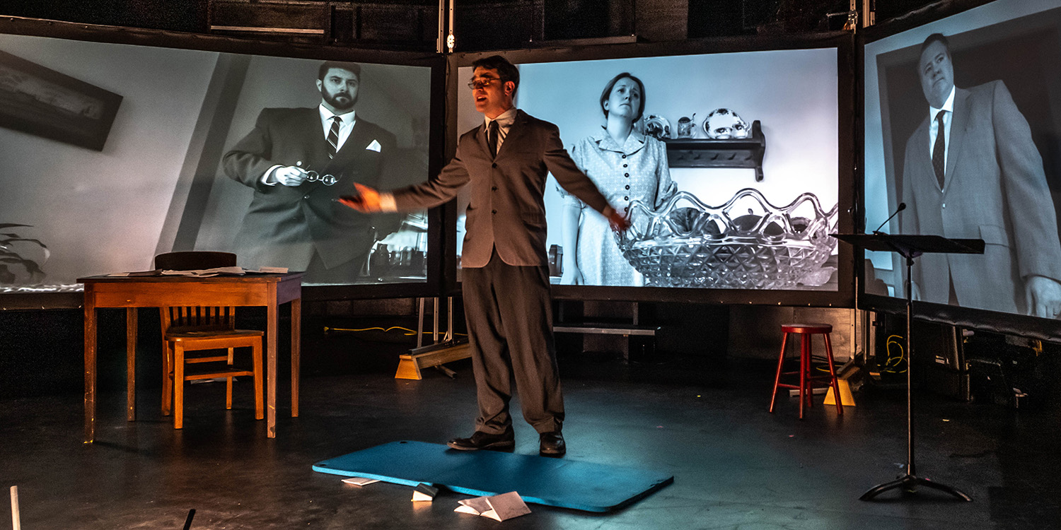 Student on stage in a theatre performance.