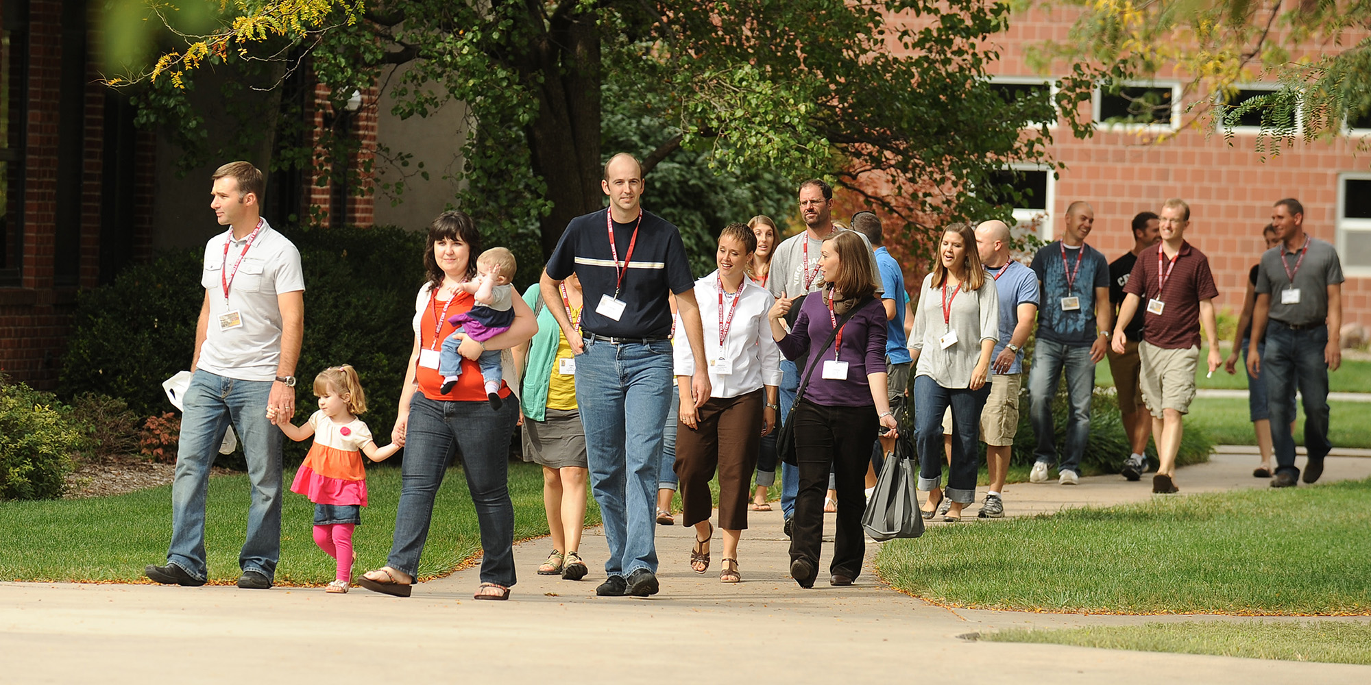 photo - Members of the class of 2002 see changes and updates on a campus tour. More than 500 alumni and friends were on campus for the weekend.