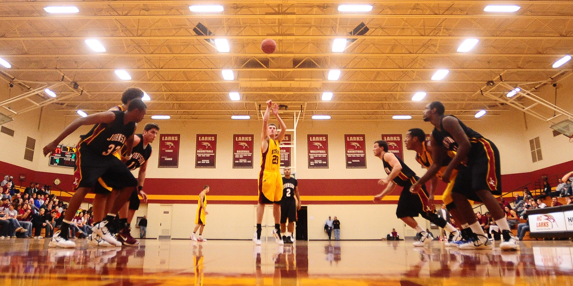 action photo - Hesston College men's basketball, Drew Emmert shoots a free throw