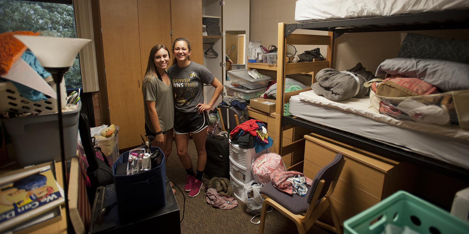 photo - Freshmen Kendall Richardson (Lodi, Calif.) and Jasmine Pankratz (Abbyville, Kan.) take their first roommate picture shortly after moving into their dorm room Aug. 19.
