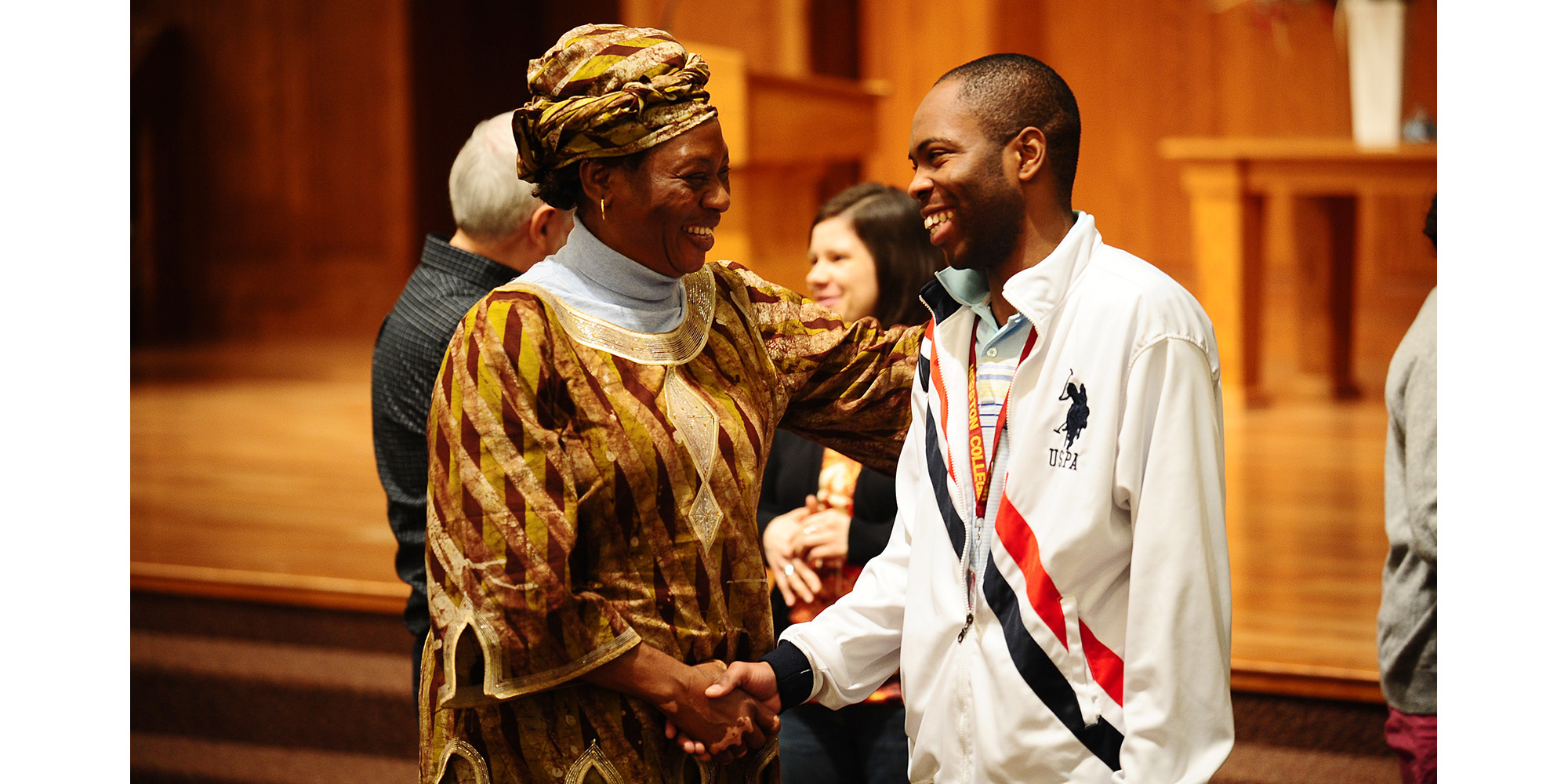 photo - Serge Kalambay Nsunzu (right), a Hesston College freshman from Kinshasa, the Democratic Republic of Congo, talks with Mawangu Cisca Ibanda, a Mennonite World Conference delegate from the Congo following a Hesston College chapel presentation Feb. 23. Ibanda, along with Cynthia Peacock of Nepal and Albert Lobe of Kitchener, Ontario, spoke to the Hesston College community about the importance of globalization in the church and the work of MWC.