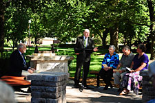 Melvin Schmidt speaks at the dedication of the Freedley Schrock memorial