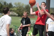 Entrepreneurship student John Oyer (center) refs a game during the three-on-three dunkball tournament he helped plan.