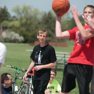 Entrepreneurship student John Oyer (center) refs a game during the three-on-three dunkball tournament he helped plan.