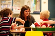 Hesston College sophomore Deb Yoder works with preschoolers in the Hesston College Lab Preschool. The preschool serves as a learning environment for both preschool children and for the college students who work with them.