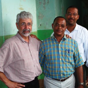 Glenn Smucker meets with Paulino Rosario Guerrero, mayor of Pedro Santana, Dominican Republic, and Cesareo Guillermo of Pan American Development Foundation on one of his short-term consulting trip.