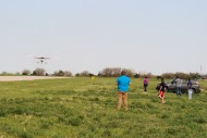 Hesston College flight instructors and onlookers watch approaching planes during the Aviation department’s annual Larks Flight Rally