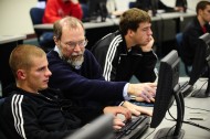 Computer faculty member Bob Harder assists a student in the Computer Information Technology lab.