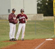 Spring 2010 - Baseball Coach Art Mullet chats with freshman Garrett Kurtz at third base while an opposing pitcher warms up.