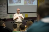 Ten Thousand Villages Public Relations Director Doug Dirks speaks to Hesston College students in David LeVan's Exploring Business class.