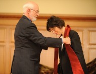 Michele Hershberger receives a stole from Marion Bontrager at her ordination service