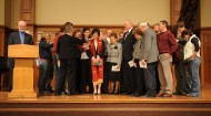 Michele Hershberger is surrounded by friends at her ordination service