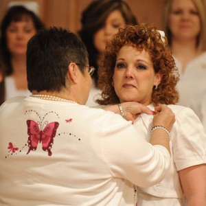 Lisa Harrelson receives her nursing pin from instructor Ruby Graber