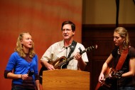 Hope Weaver, Herm Weaver and sophomore Chloe Weaver sing and share during Friday morning’s Centennial Homecoming Chapel.