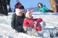 Hesston students enjoy the town's sledding hill on a snowy day.