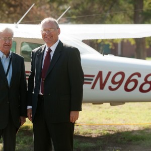 Former President Laban Peachey (1968 to 1980) and President Howard Keim pose with the Hesston College airplane with the radio call numbers in honor of President Peachey. Each of the college’s five planes’ call numbers includes the inauguration year of one of the presidents.