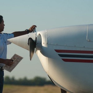 Hesston College sophomore Kush Lengacher prepares a plane for flight.