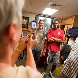 Freshmen roommates David Rudy (Manheim, Pa.) and Michel Anderson (Wichita, Kan.) pose for Rudy’s mother, Carolyn, as they moved in to Kauffman Court at the beginning of the year.