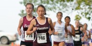 Sophomore Krista Rittenhouse (Mt. Pleasant, Pa.) leads a pack of runners. Photo by Curtis Denlinger