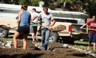 Jacob Landis works in the campus community garden. He brought methods and techniques he learned on the family farm for improved sustainability to campus.