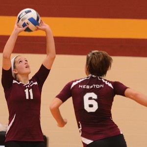 Maggie Lasater sets the ball for Lacey Crenshaw.