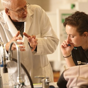 Jim Yoder ’62 works with Kassade Thomas ’13 in the chemistry lab.