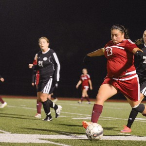 Enneliese Alcantar drives the ball up the left sideline in the playoff game vs. Butler County.